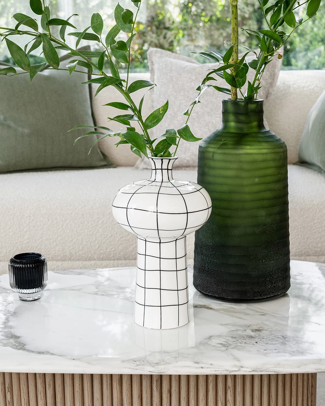 Iris Arneson vases in white and black, shown in a lifestyle front view as image 2