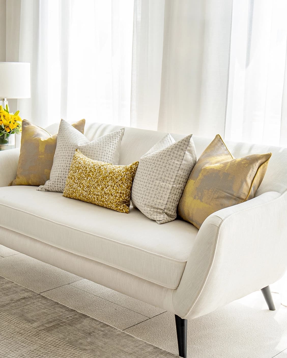 Ivan Bundle cushion in gold and silver, shown in a product right view as image 2
