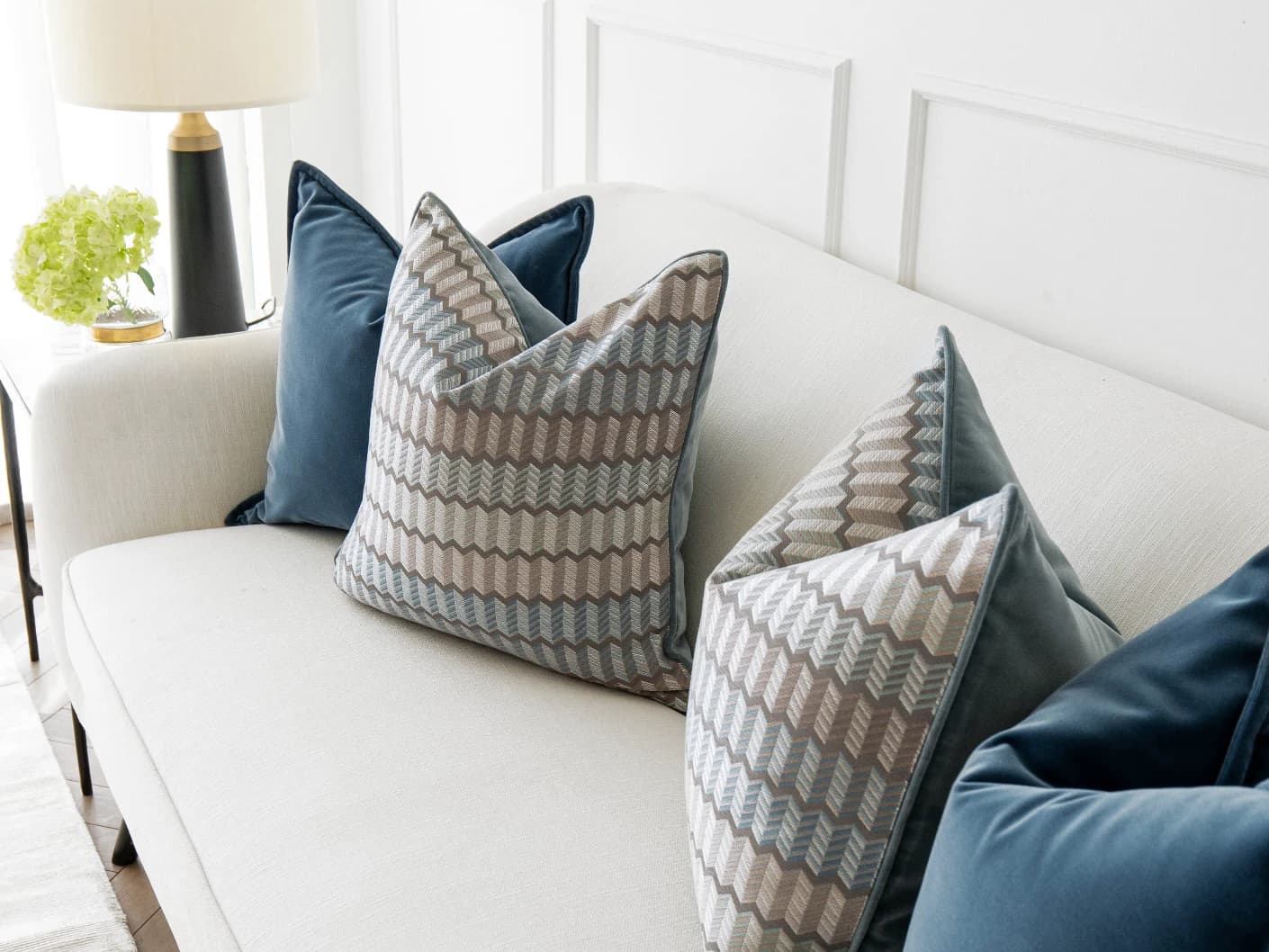 Ivy Bundle bundle cushions in blue and silver, shown in a lifestyle front view