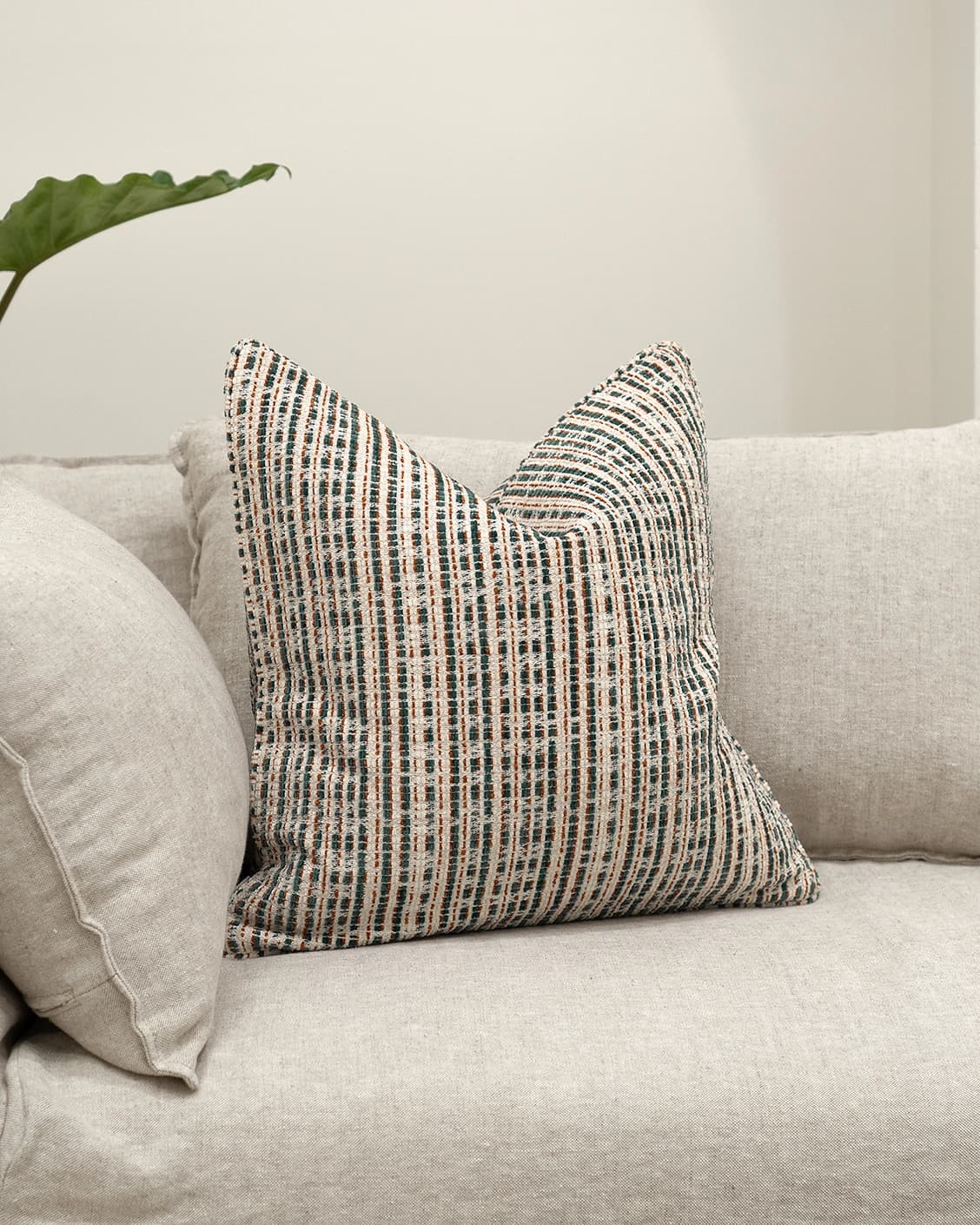 Izzy Canova cushion in ivory and multicolour, shown in a lifestyle front view as image 2