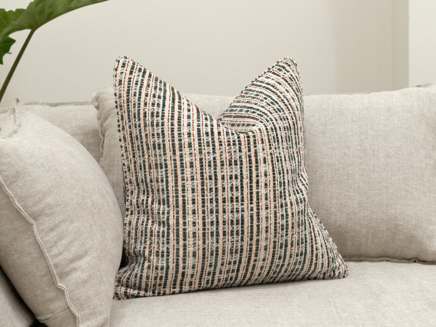 Izzy Canova single cushions in ivory and multicolour, shown in a lifestyle front view