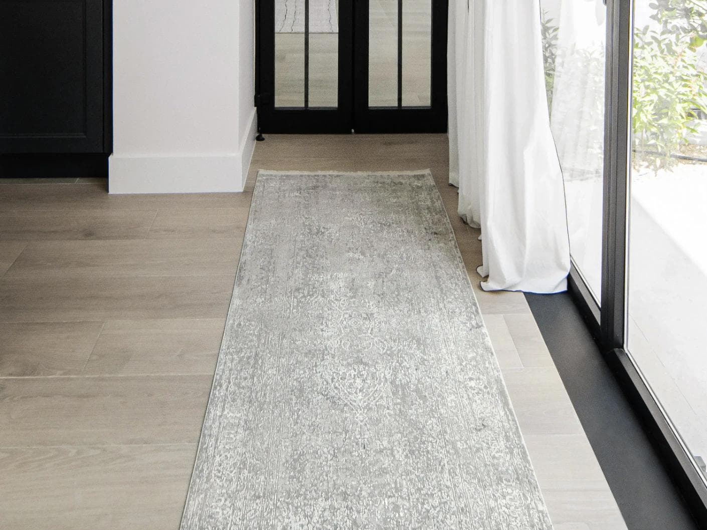 Jacob Alba carpets in grey, shown in a lifestyle front view as image 1