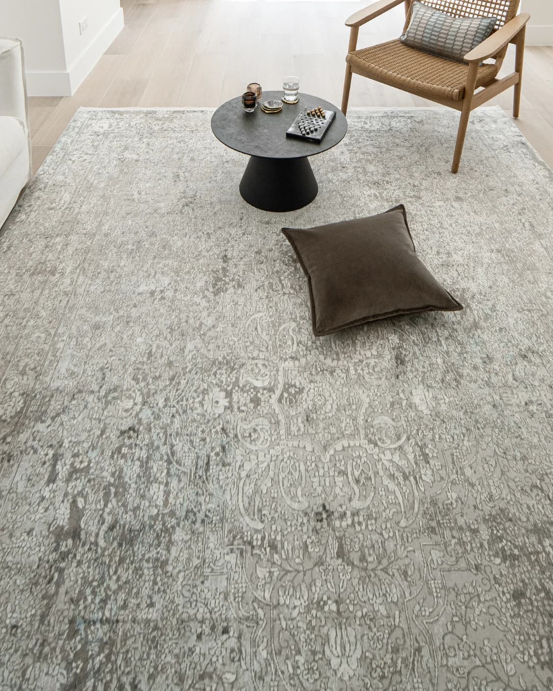 Jacob Alba carpet in grey, shown in a lifestyle top view as image 9