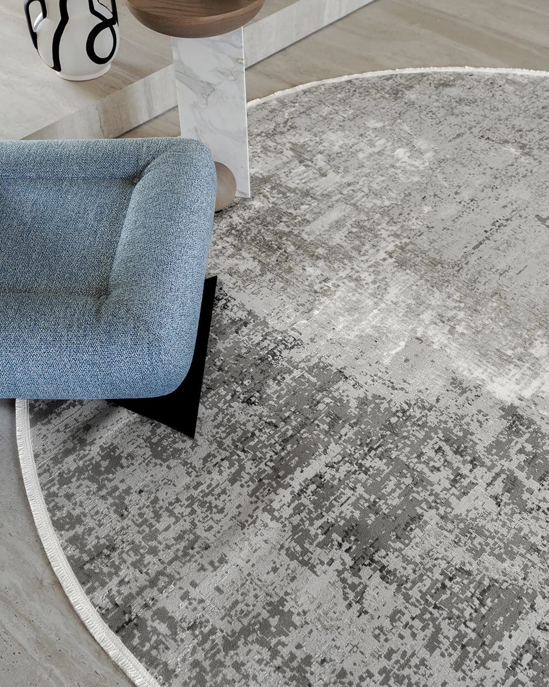 Jacob Ashton carpets in grey, silver and white, shown in a lifestyle close-up top view as image 1
