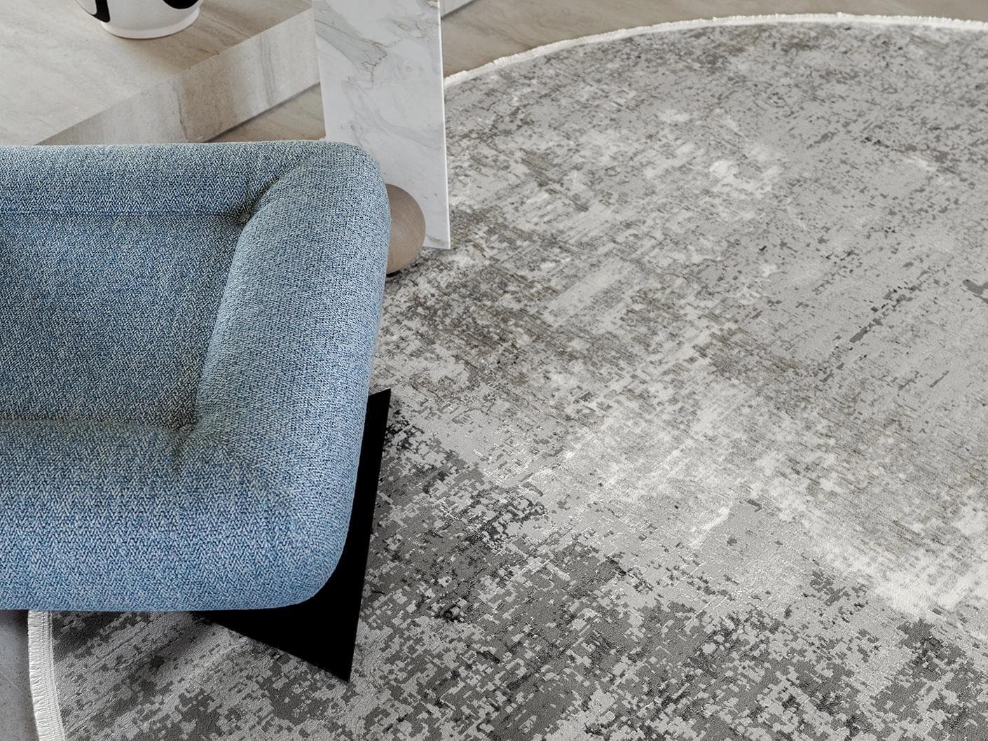 Jacob Ashton carpets in grey, silver and white, shown in a lifestyle close-up top view as image 1