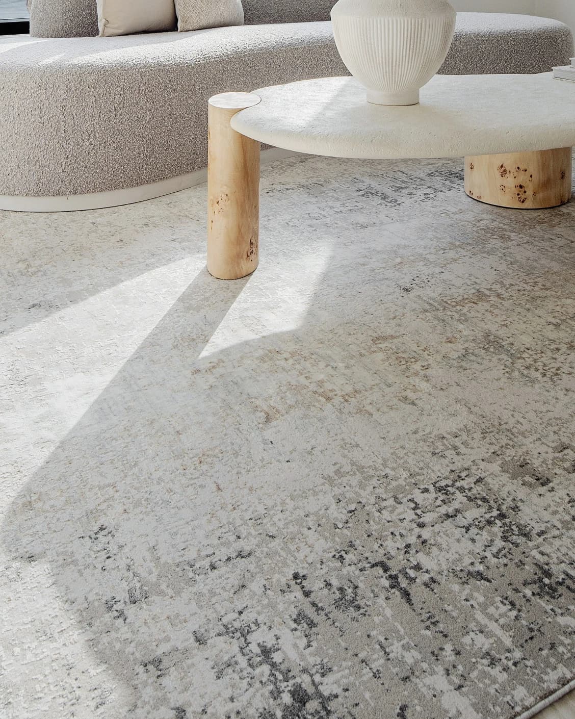 Jacob Ashton carpet in grey, silver and white, shown in a lifestyle close-up as image 4