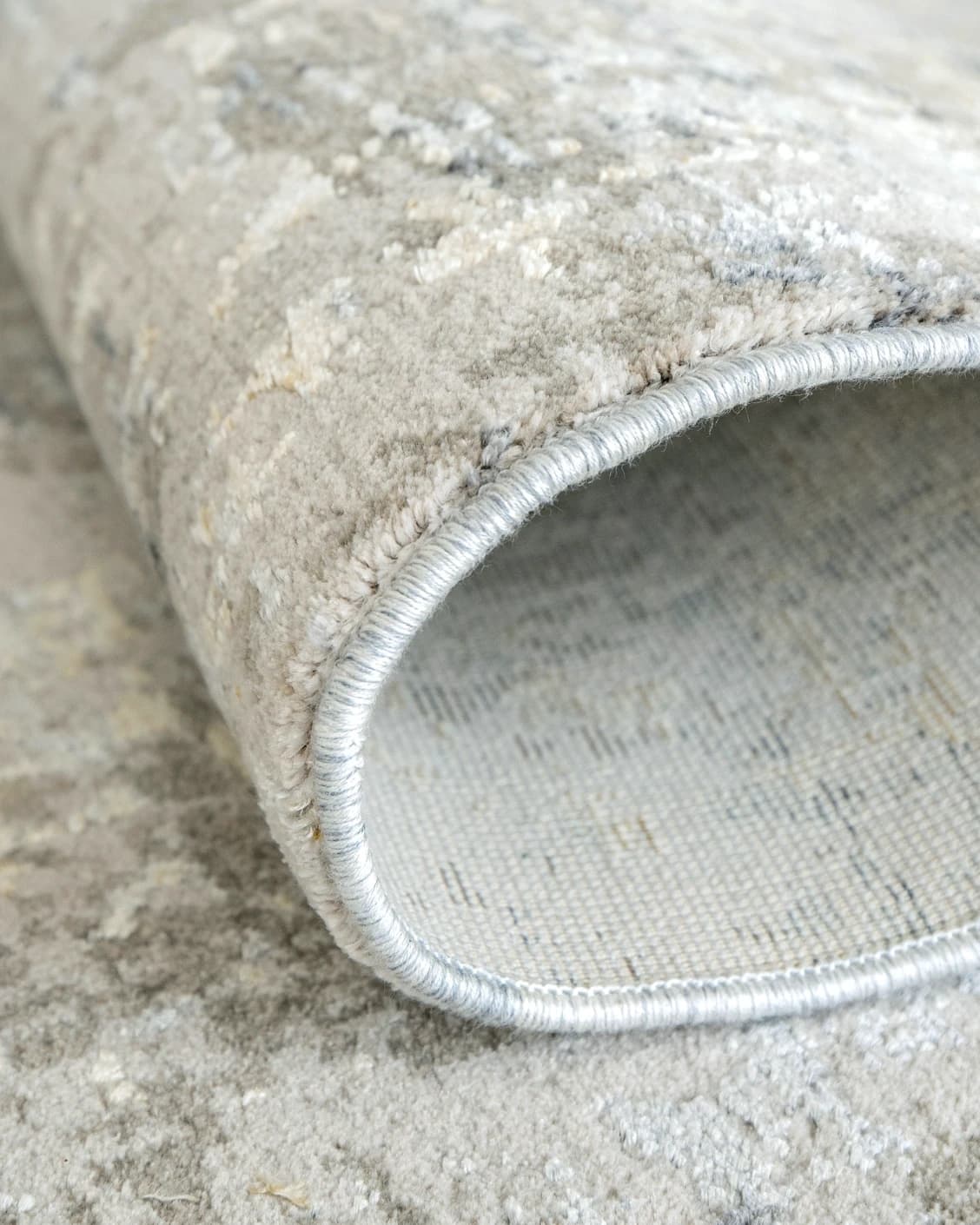 Jacob Ashton carpet in grey, silver and white, shown in a product close-up as image 7