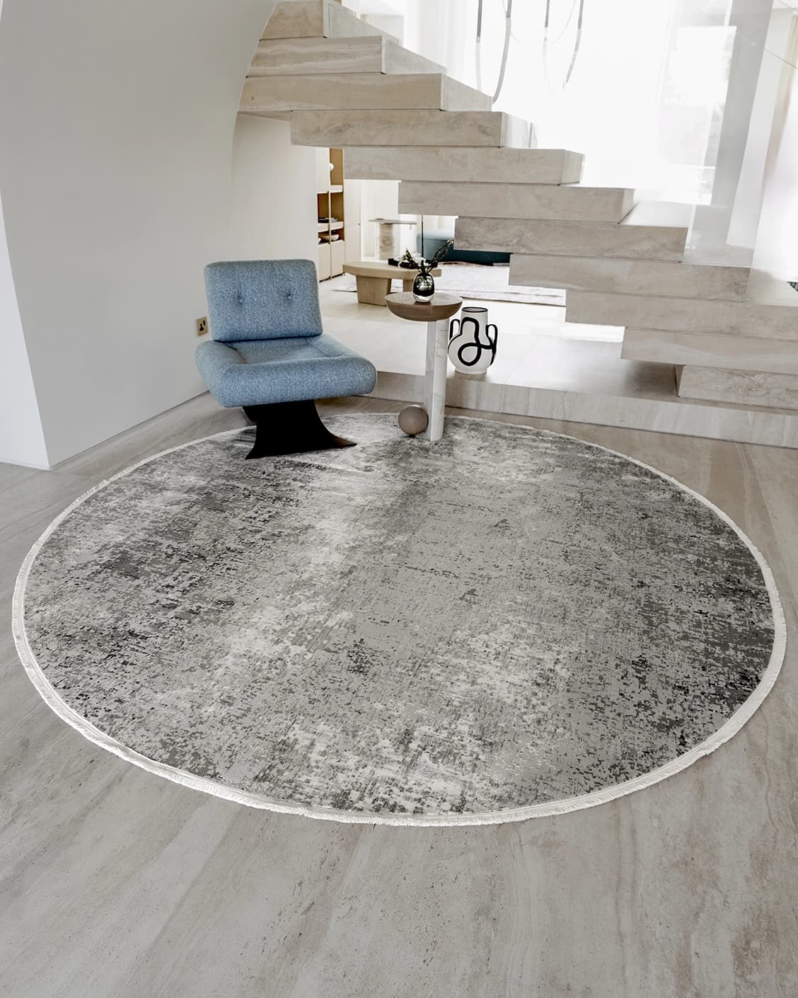 Jacob Ashton Round carpet in grey, silver and white, shown in a lifestyle front view as image 2