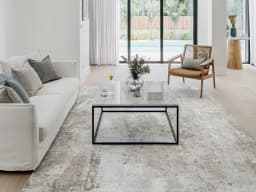 Jacob Azure carpet in azure, grey and blue, shown in a lifestyle front view