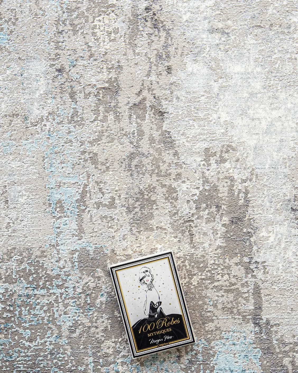 Jacob Azure carpet in grey and blue, shown in a lifestyle top view as image 9