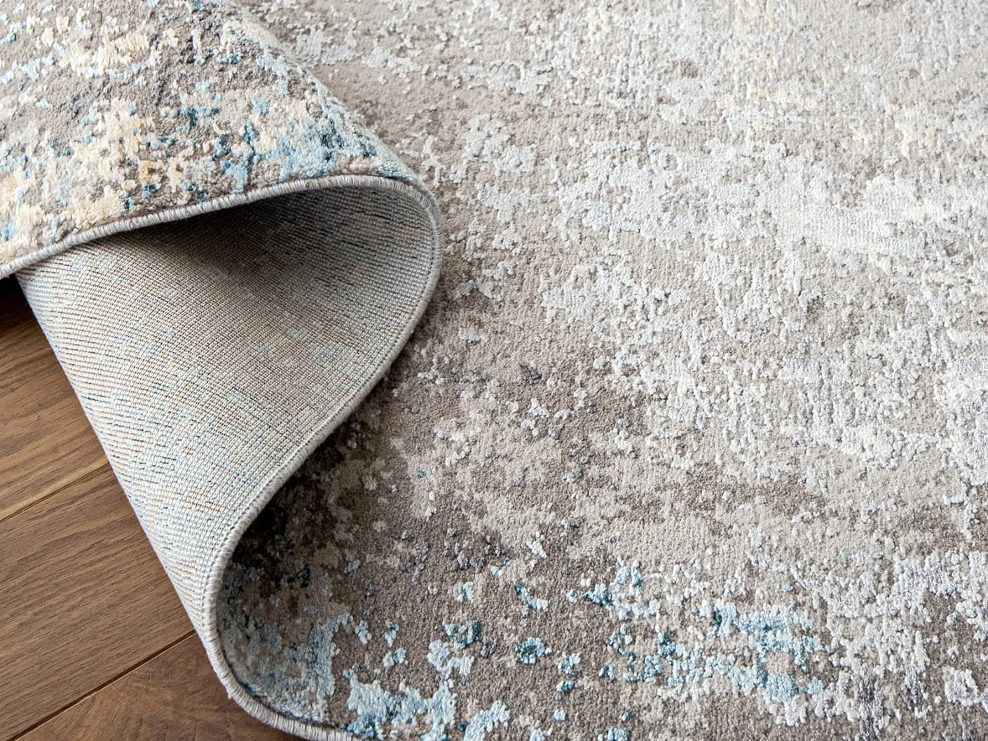 Jacob Azure carpets in azure, grey and blue, shown in a product close-up view