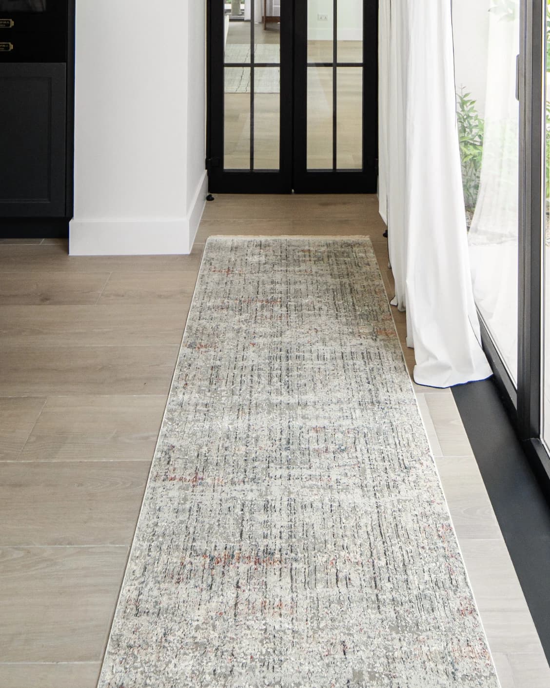 Jacob Sandy Runners carpet in sandy, rust and grey, shown in a lifestyle front view as image 2