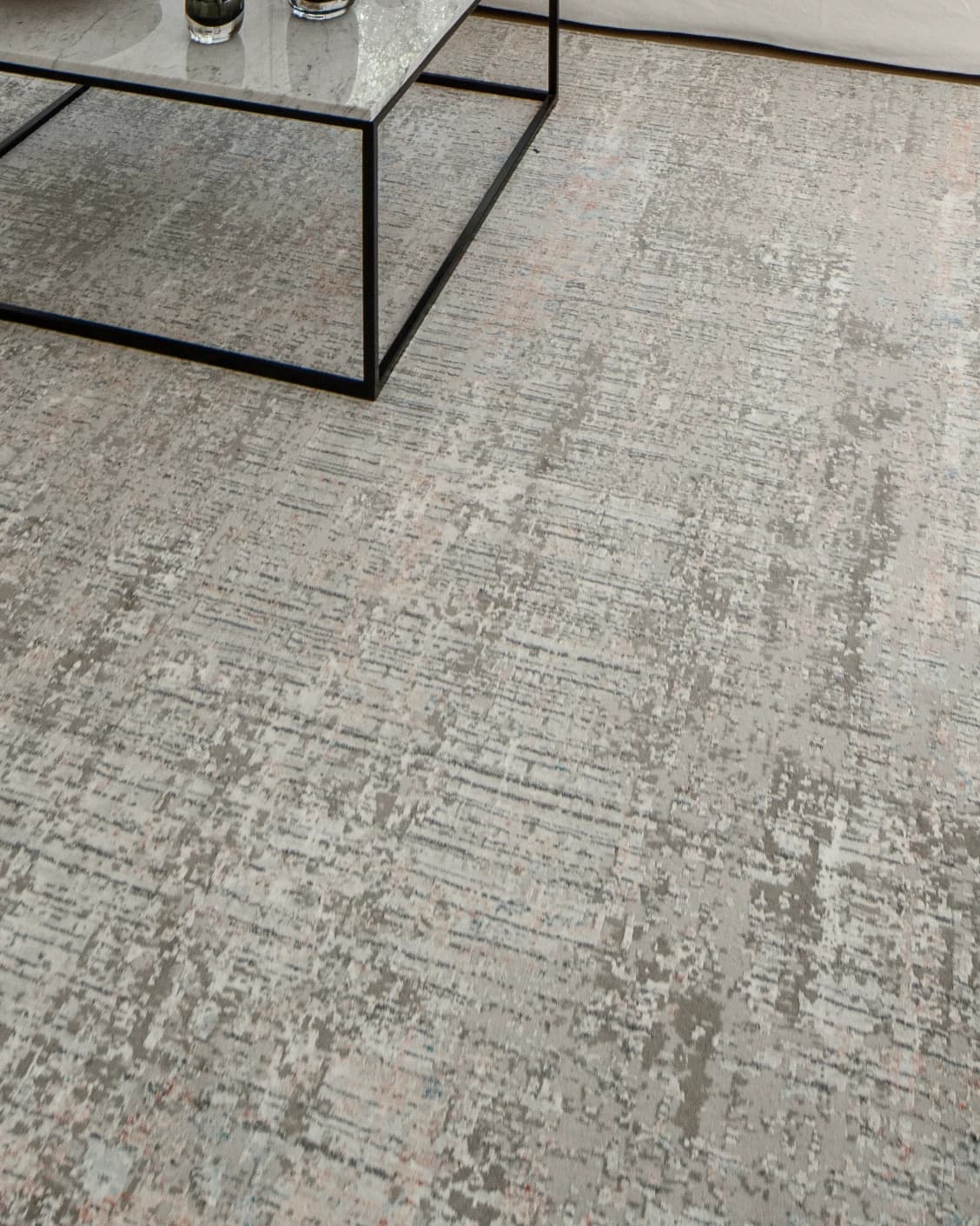 Jacob Sandy carpet in rust and grey, shown in a lifestyle close-up as image 4