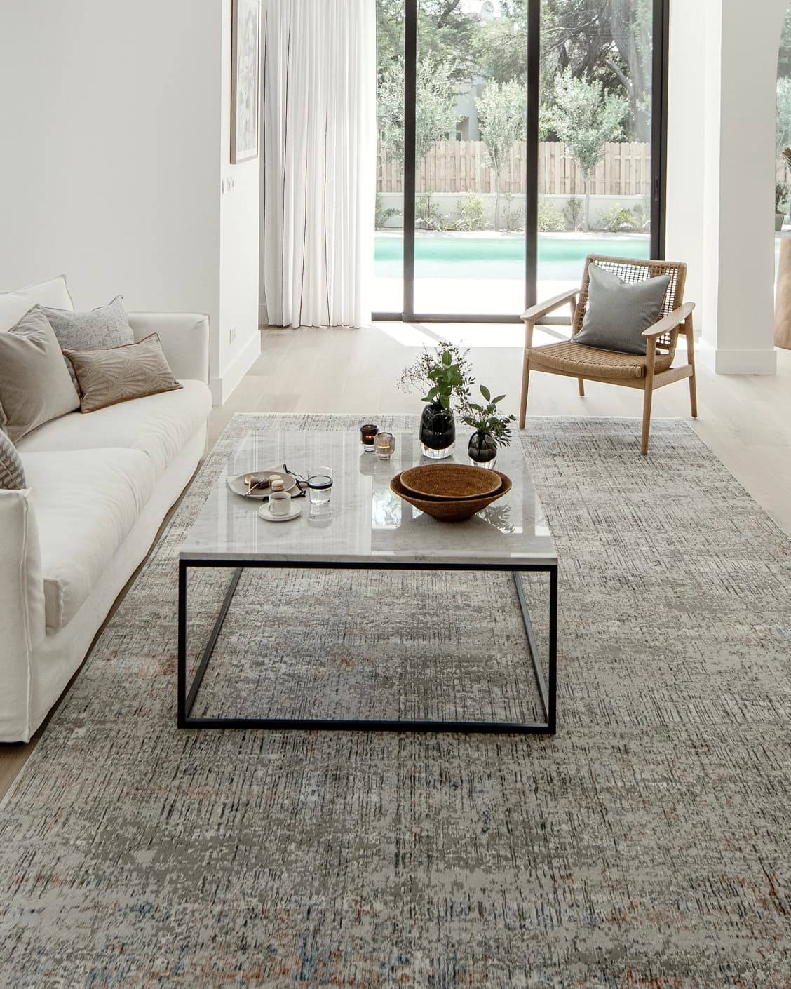 Jacob Sandy carpet in rust and grey, shown in a lifestyle front view as image 6