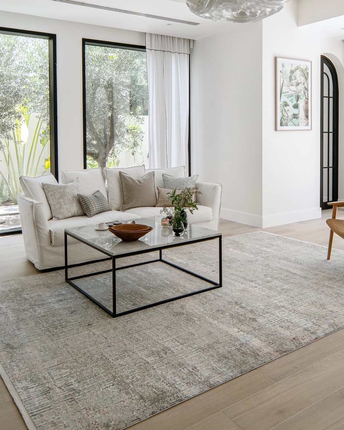 Jacob Sandy carpet in rust and grey, shown in a lifestyle left view as image 7