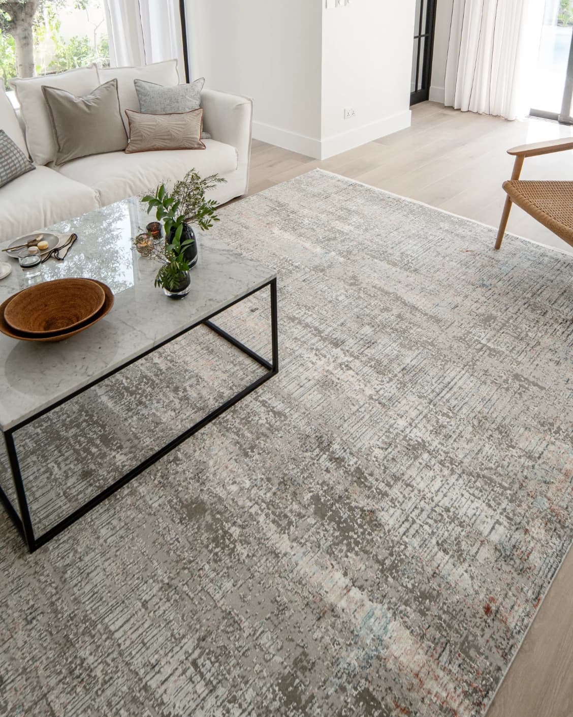 Jacob Sandy carpet in rust and grey, shown in a lifestyle left view as image 8