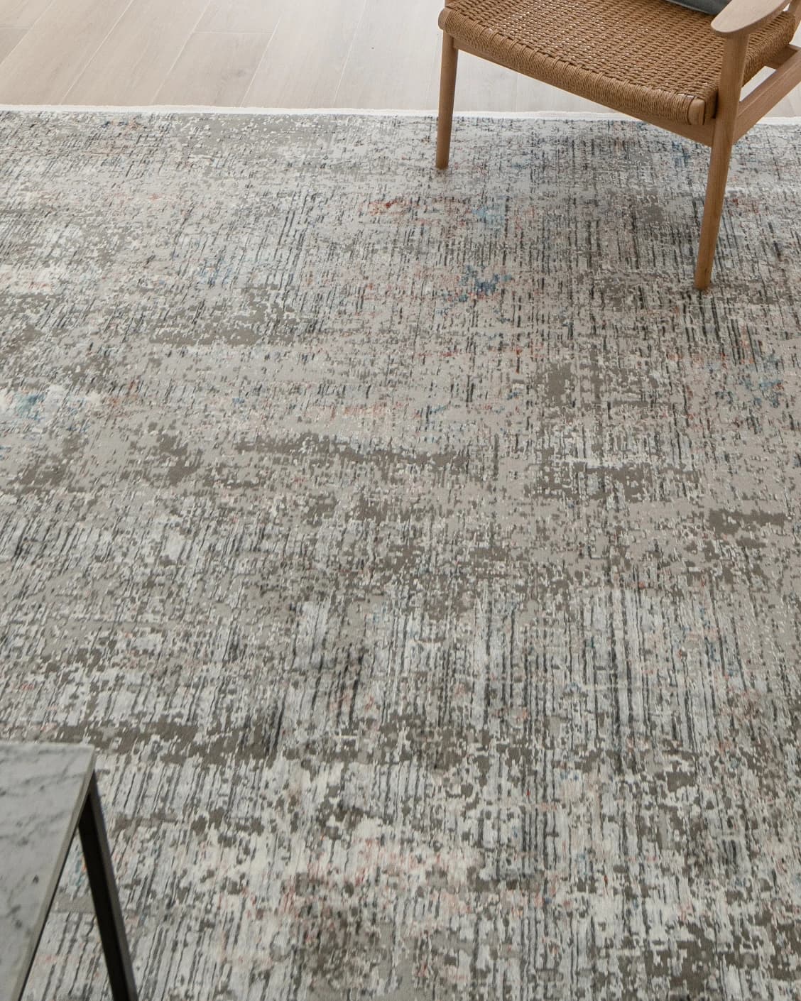 Jacob Sandy carpet in rust and grey, shown in a lifestyle top view as image 10
