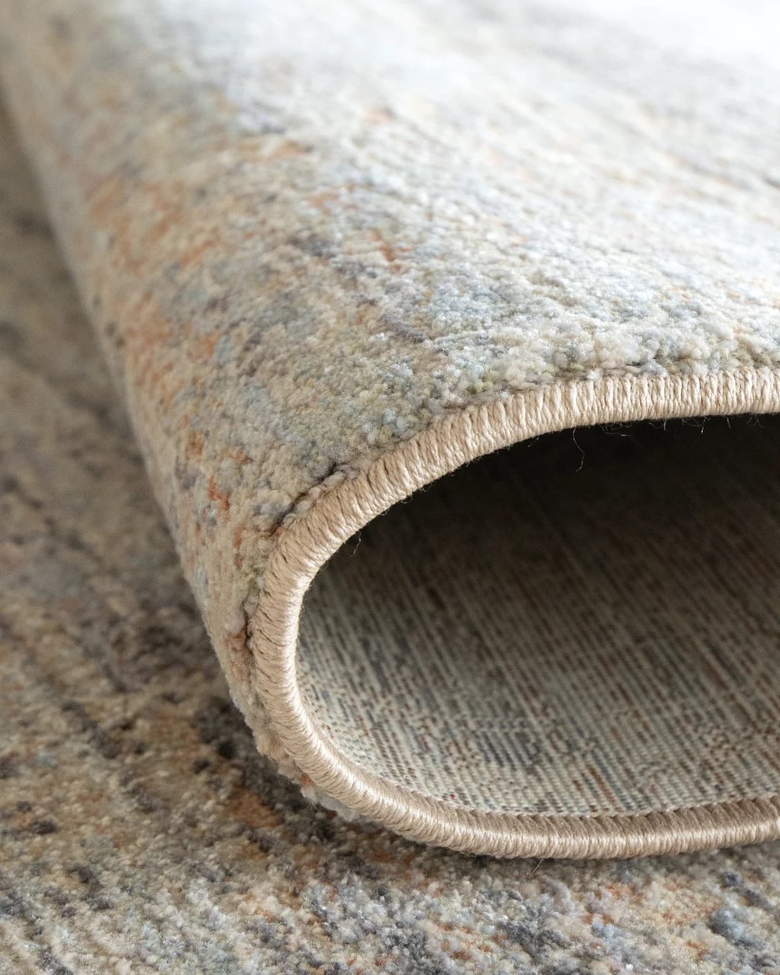 Jacob Sandy carpet in rust and grey, shown in a product close-up as image 11