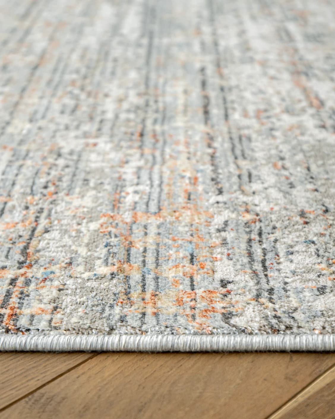 Jacob Sandy carpet in rust and grey, shown in a product close-up as image 12