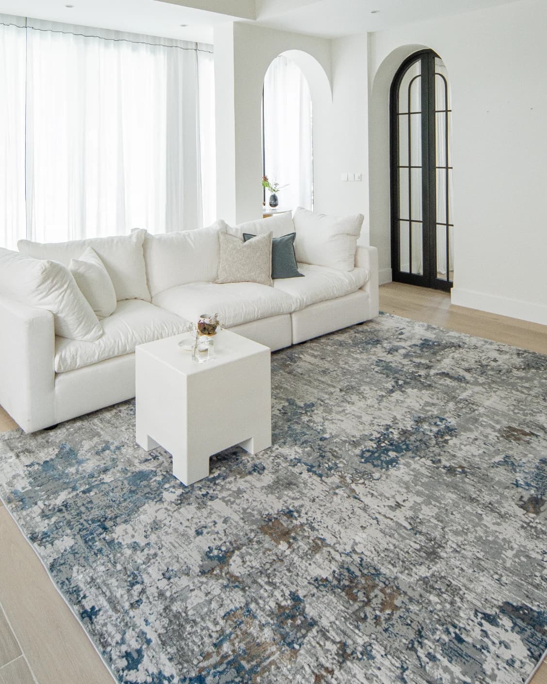 Jacob Sky carpet in blue and grey, shown in a lifestyle left view as image 5