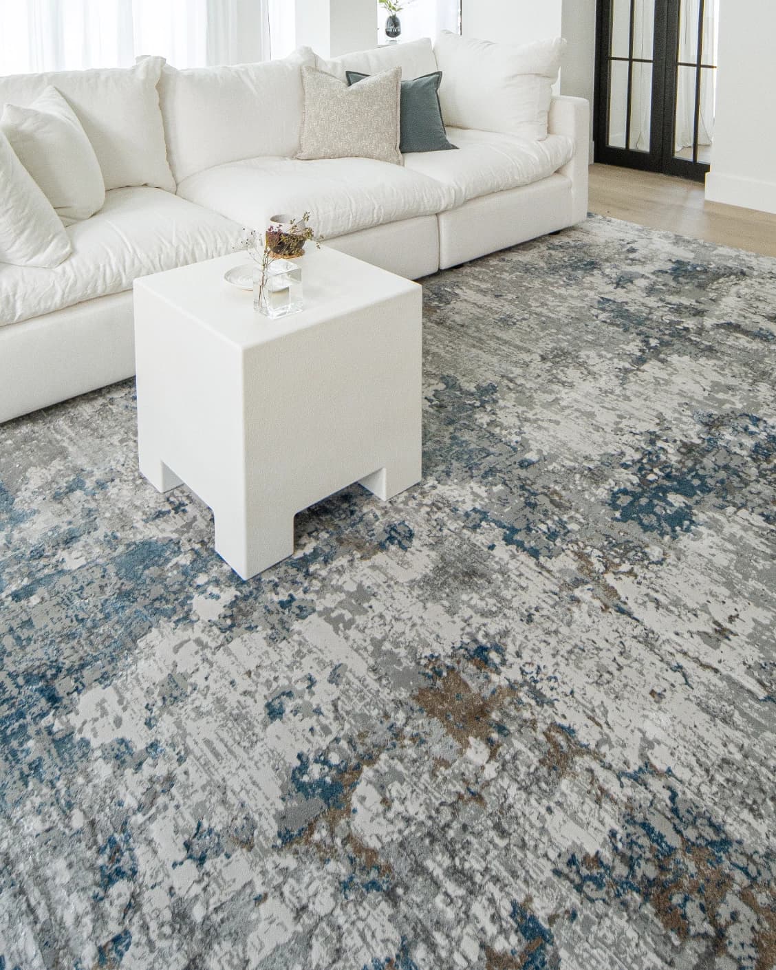 Jacob Sky carpet in blue and grey, shown in a lifestyle left view as image 6