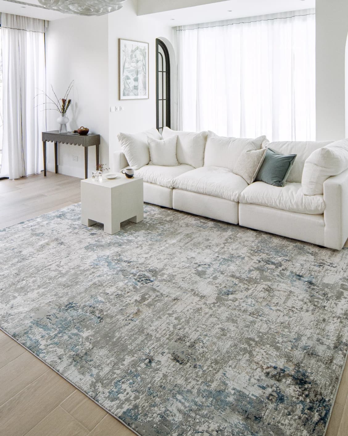 Jacob Sky carpet in blue and grey, shown in a lifestyle right view as image 7