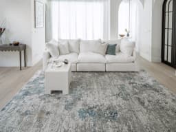 Jacob Sky carpet in sky, blue and grey, shown in a lifestyle front view
