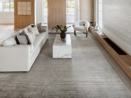 Jade Ashton carpet in grey, shown in a lifestyle front view