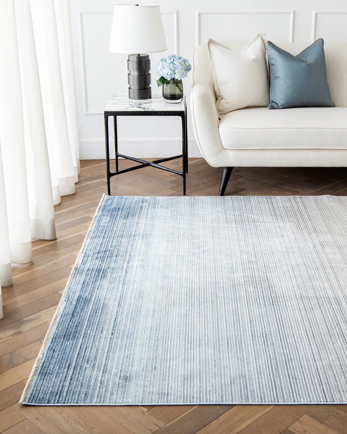 Jade Sky carpet in blue, shown in a lifestyle front view as image 4