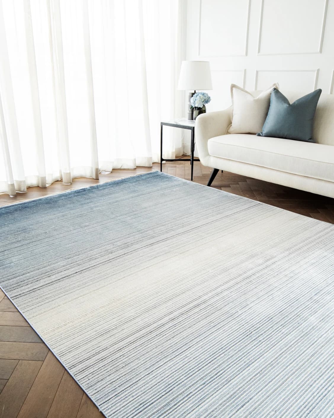 Jade Sky carpet in blue, shown in a lifestyle right view as image 5