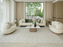 Jaxon Bianca carpet in ivory and charcoal, shown in a lifestyle front view