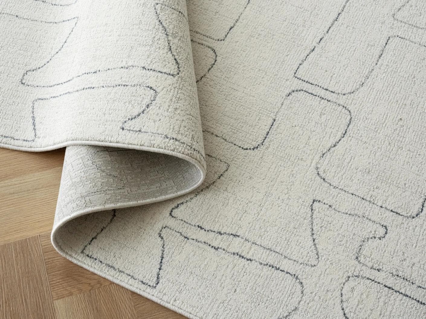 Jaxon Bianca carpet in ivory and charcoal, shown in a lifestyle close-up as image 4