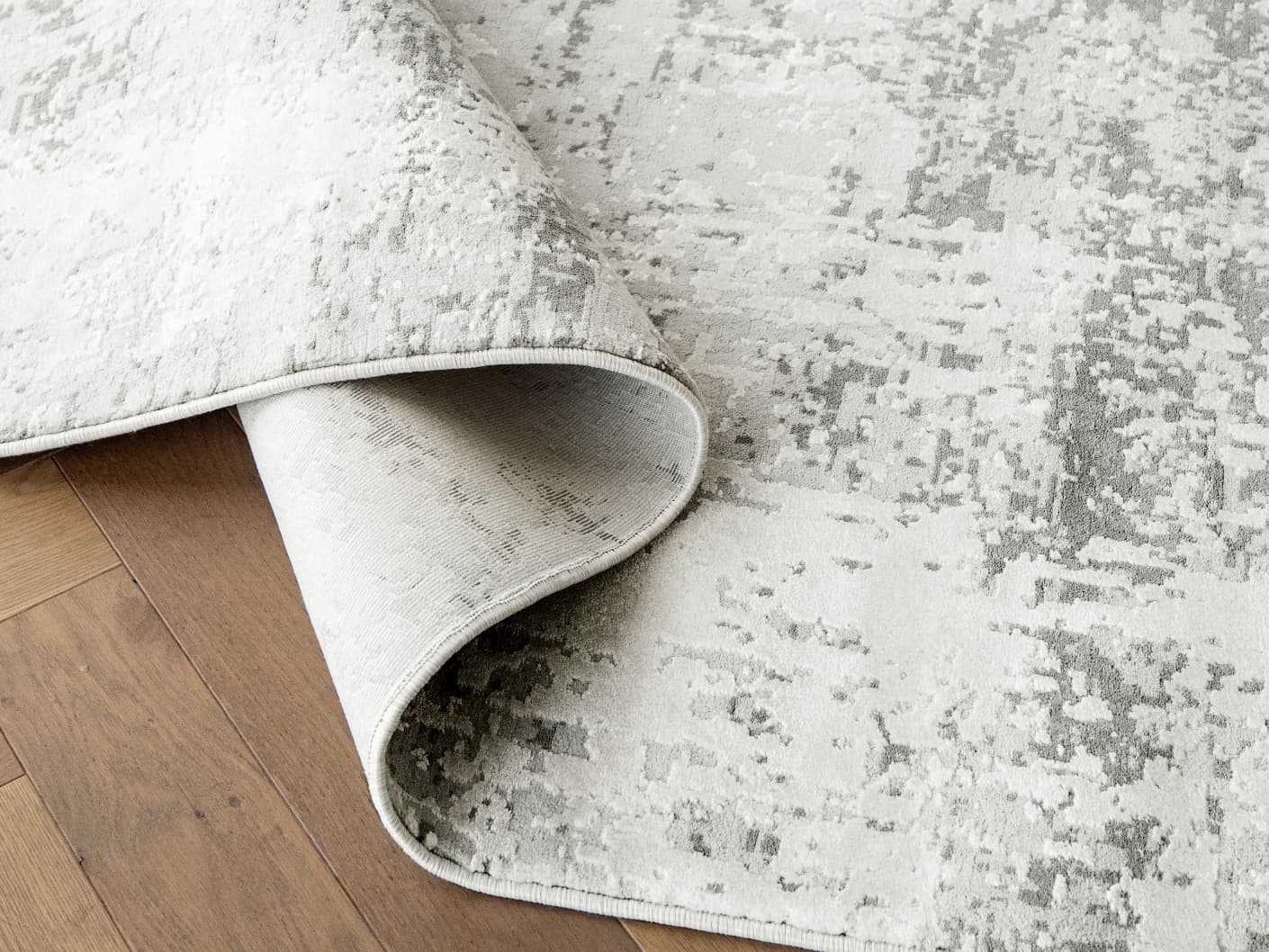 Jay Ashton Round carpets in grey, shown in a product close-up view
