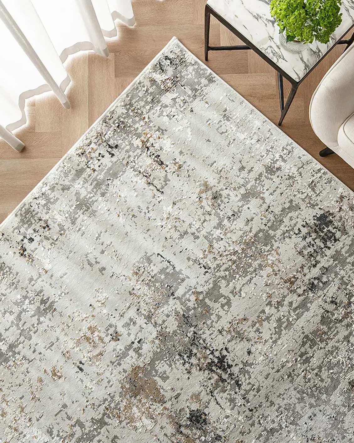 Jay Haywoods carpet in grey, shown in a lifestyle top view as image 2