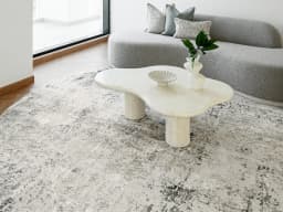 Jay Haywoods Round carpet in grey, shown in a lifestyle front view