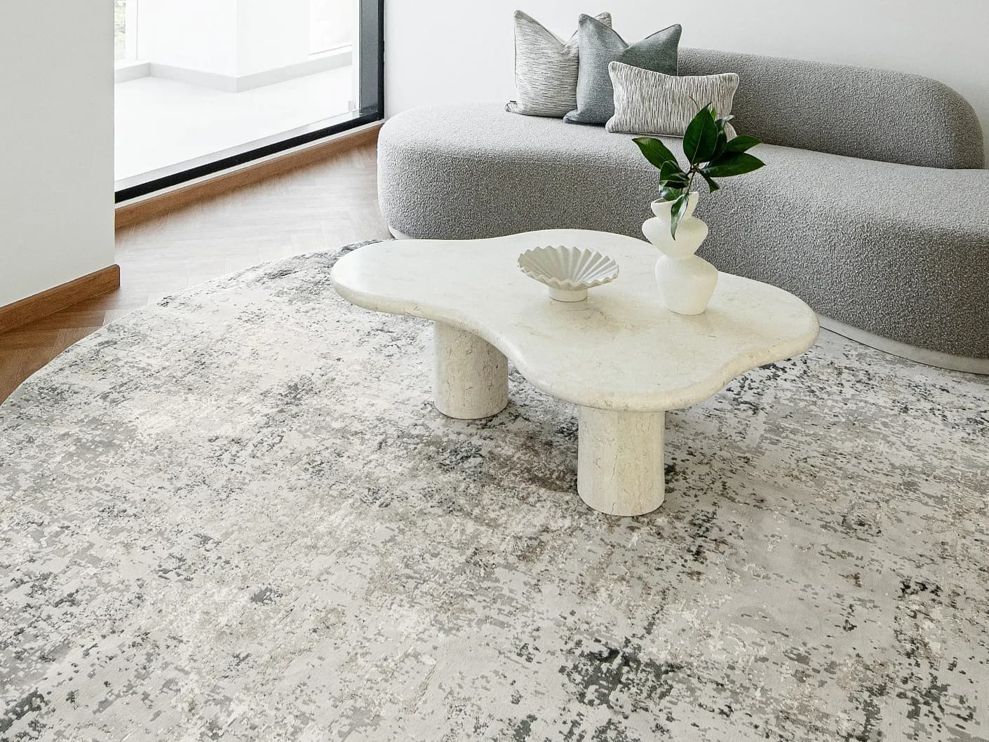 Jay Haywoods Round carpet in grey, shown in a lifestyle front view