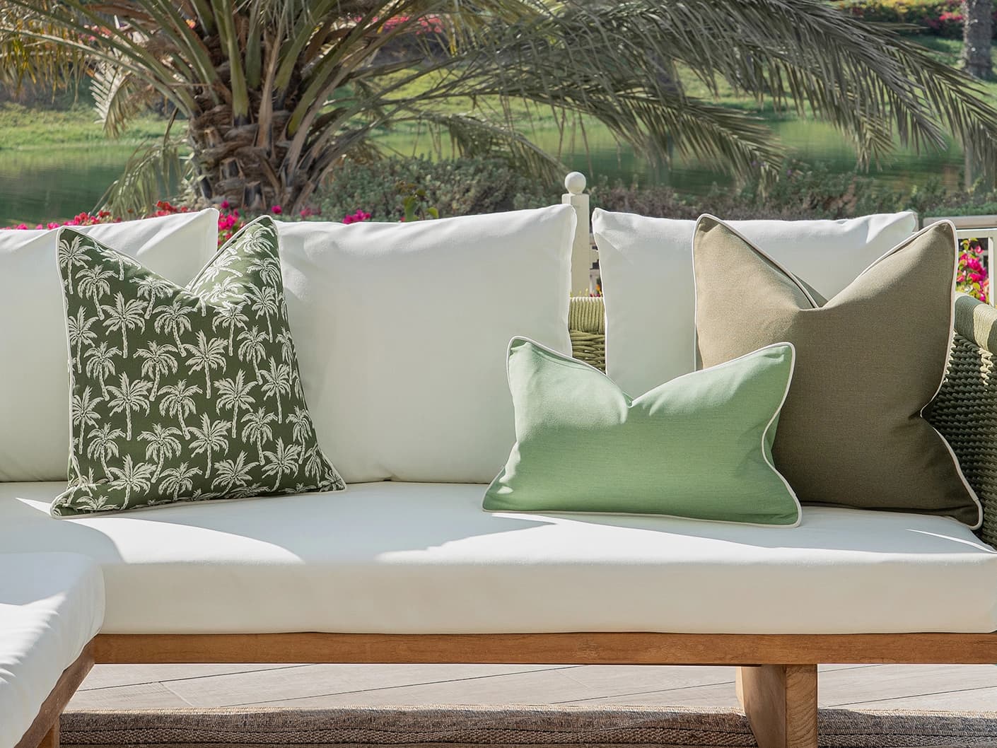 Jeeva Bundle bundle cushions in green, shown in a lifestyle front view