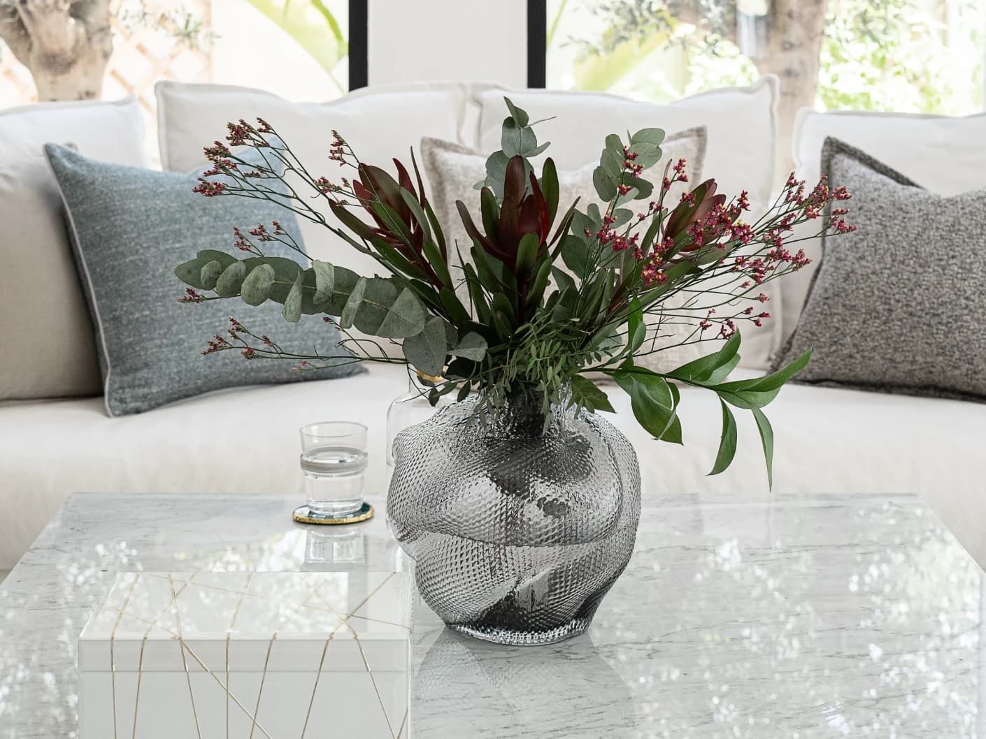 Jeremy Storms vases in grey, shown in a lifestyle front view