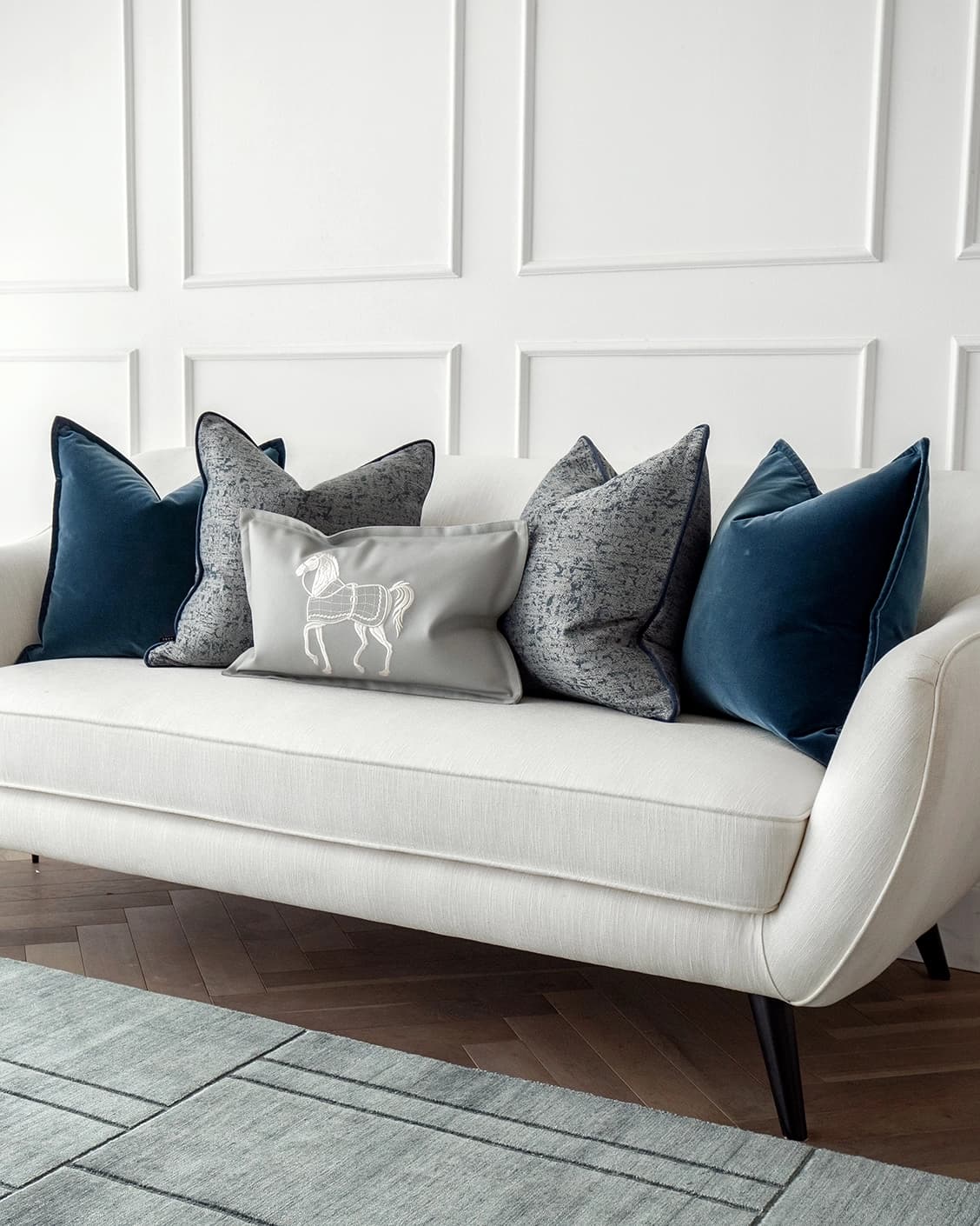 John Bundle cushion in blue, silver and white, shown in a lifestyle right view as image 2