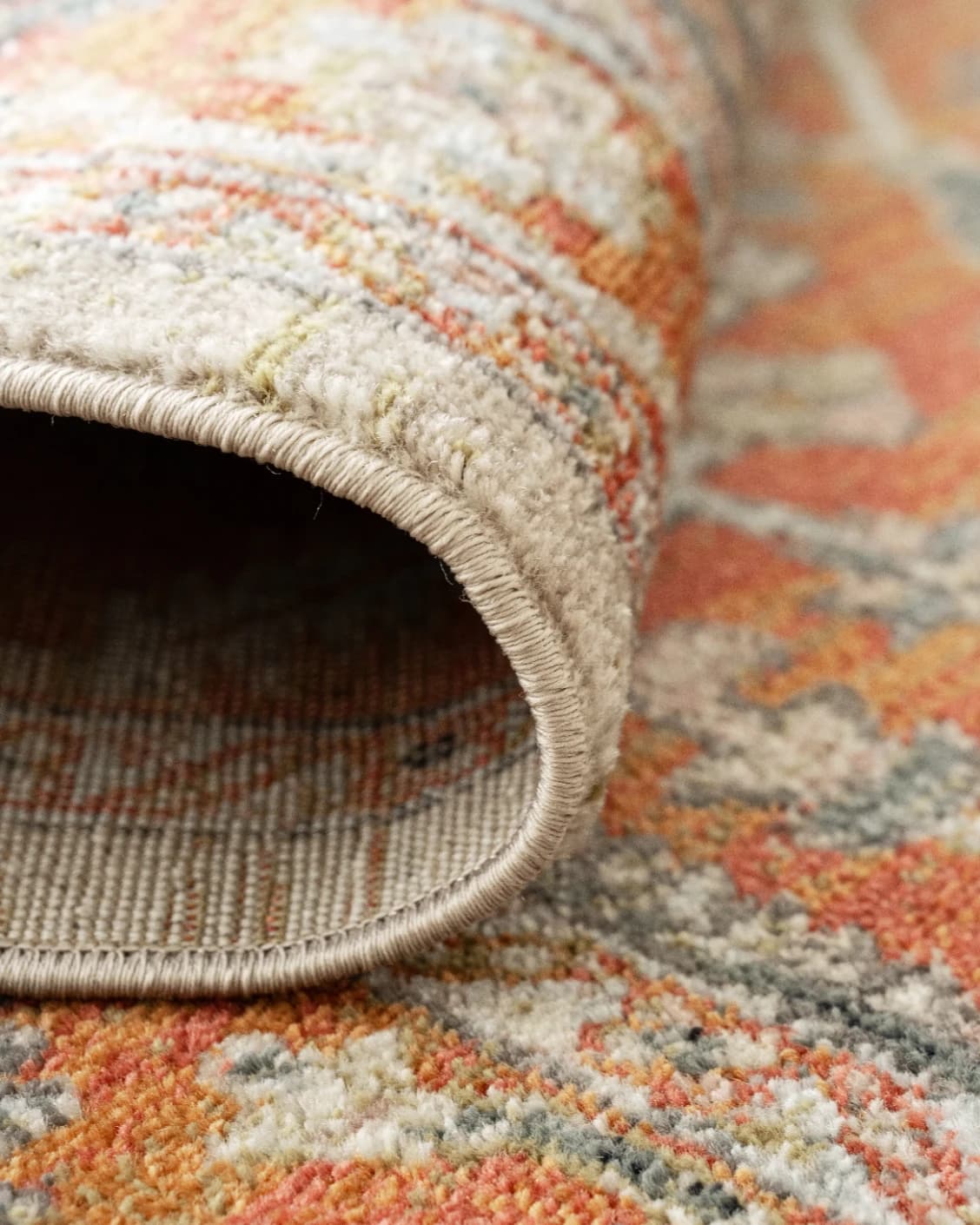 Julian Copper carpet in red and beige, shown in a product close-up as image 10