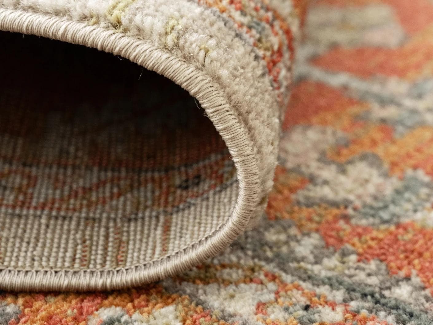 Julian Copper carpets in red and beige, shown in a product close-up as image 2