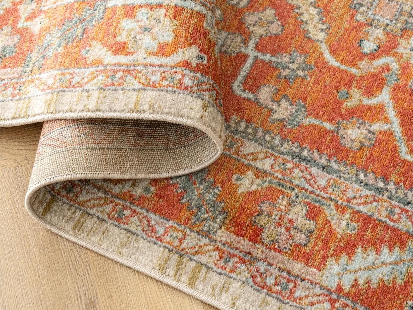 Julian Copper carpets in red and beige, shown in a product close-up as image 1