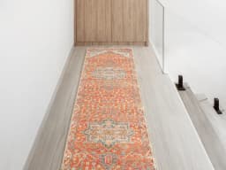 Julian Copper Runners carpet in red and beige, shown in a lifestyle front view