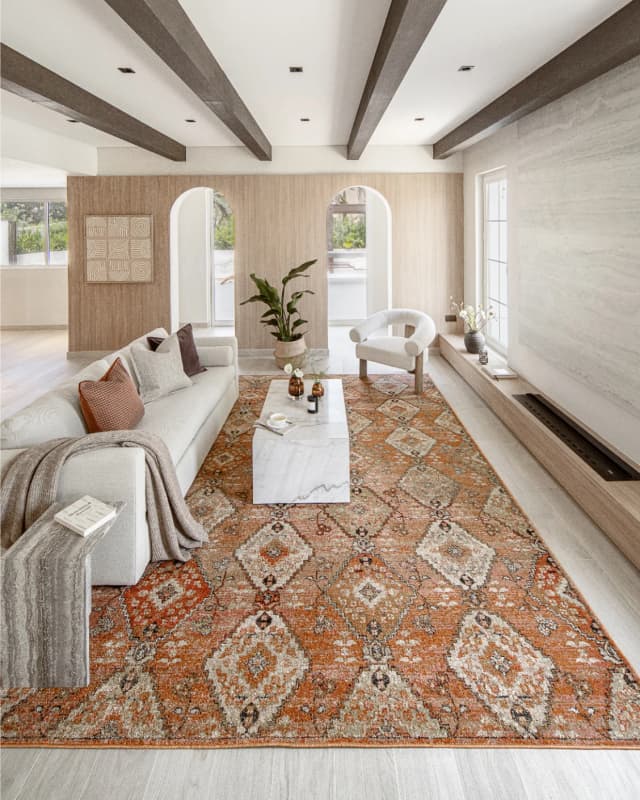 Julian Coral carpet in coral, orange and rust, shown in a lifestyle left view as image 5