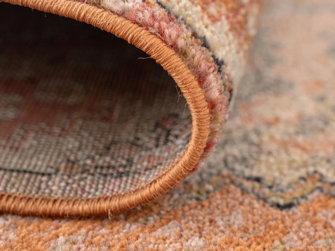 Julian Coral carpets in orange and rust, shown in a product close-up as image 2