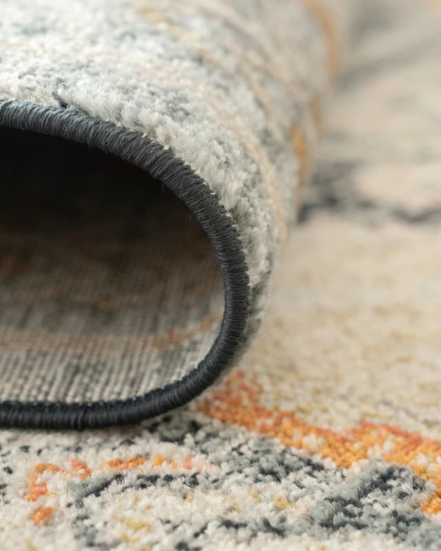 Julian Navy carpets in beige, blue and multicolour, shown in a lifestyle front view as image
