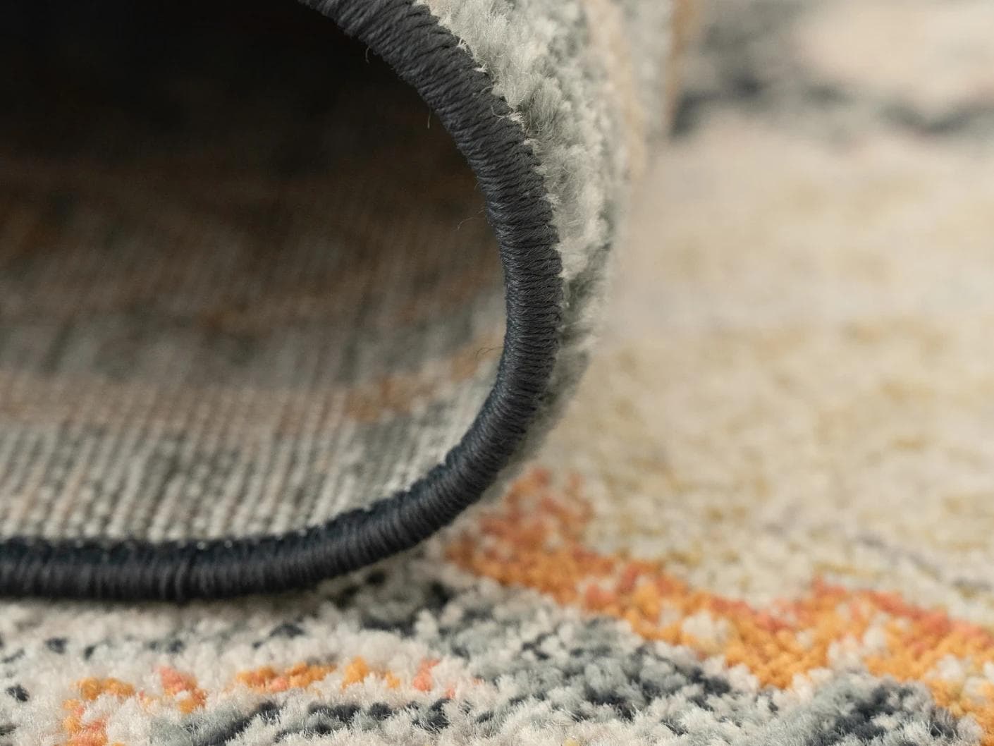 Julian Navy carpets in beige, blue and multicolour, shown in a product close-up as image 2