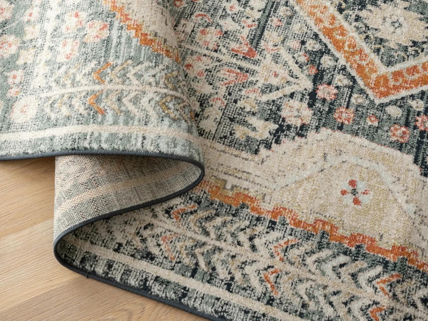 Julian Navy carpets in beige, blue and multicolour, shown in a product close-up as image 1