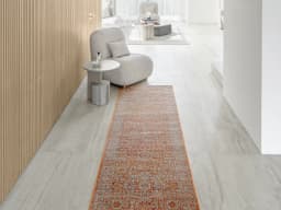 Julian Rust Runners carpet in orange, shown in a lifestyle front view