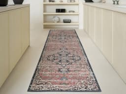 Julian Terracotta Runners carpet in grey and pink, shown in a lifestyle front view